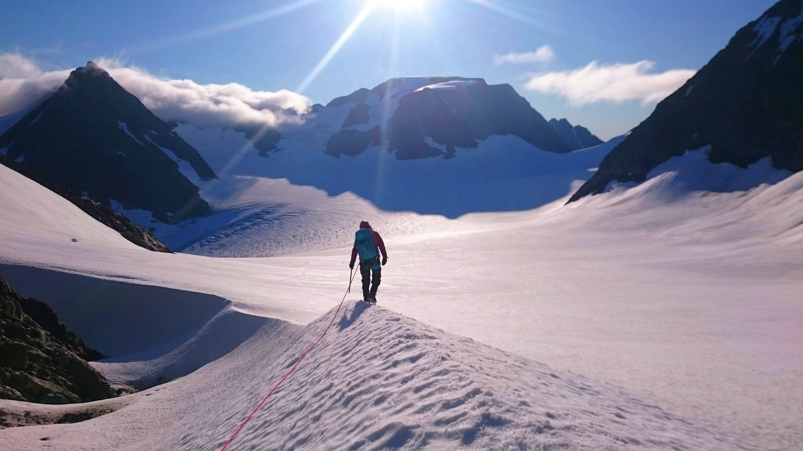 One person walkinf on the back of an glacier.