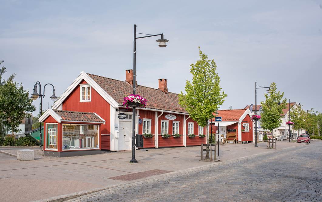 red house in a street 