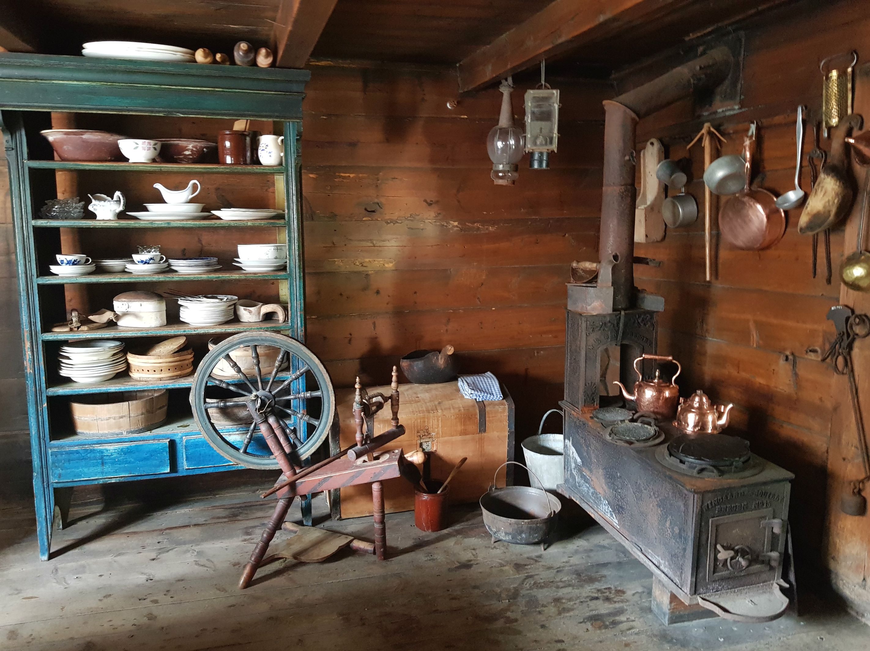 A kitchen with various kinds of utensils 