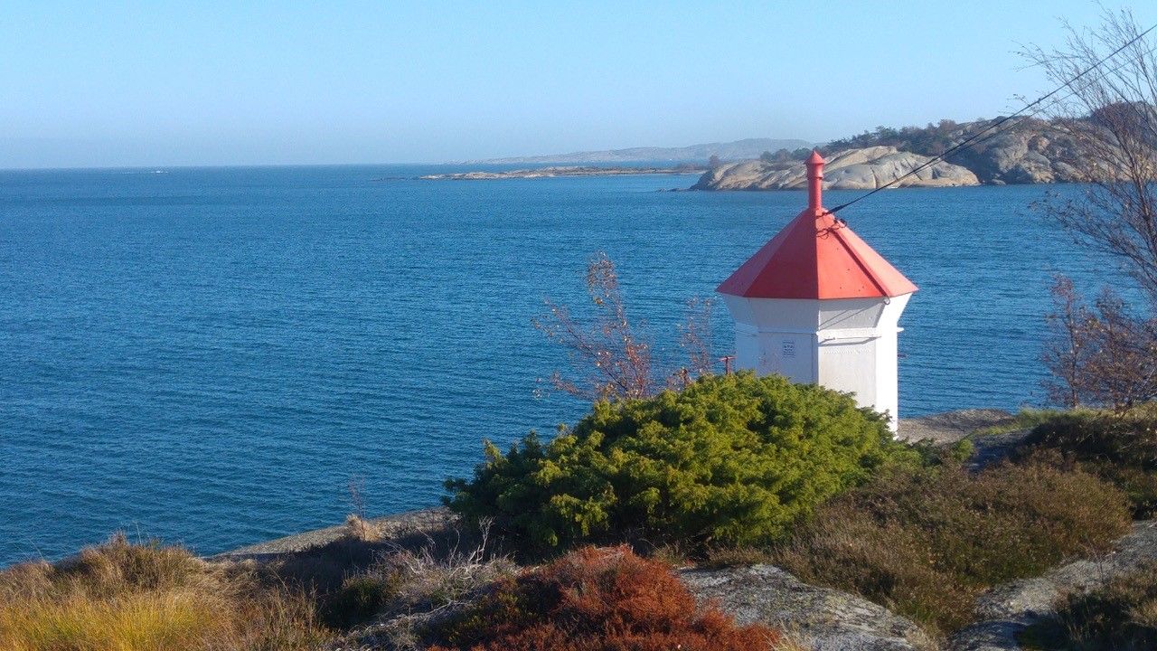 Sea and mountains and lighthouse