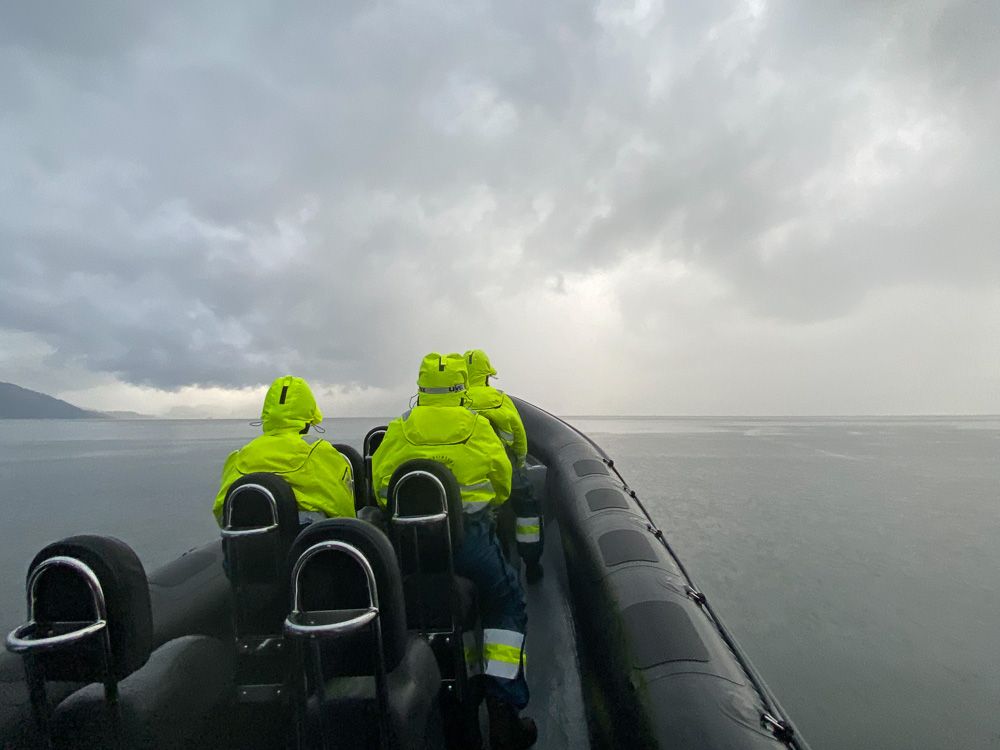Adventurous passengers on a RIB boat experience the dramatic weather over the Hardangerfjord.