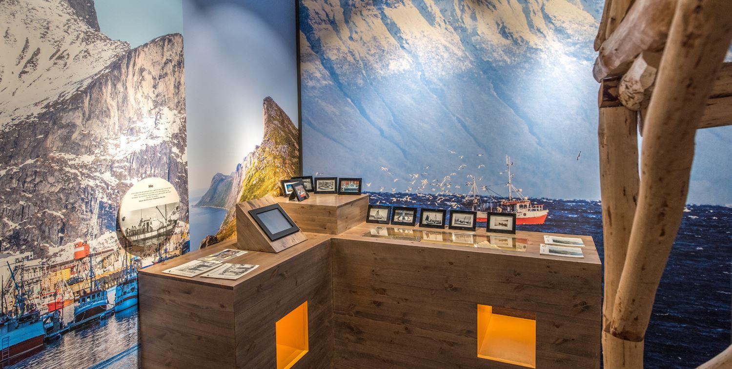Inside the Sámi museum with pictures covering the walls.