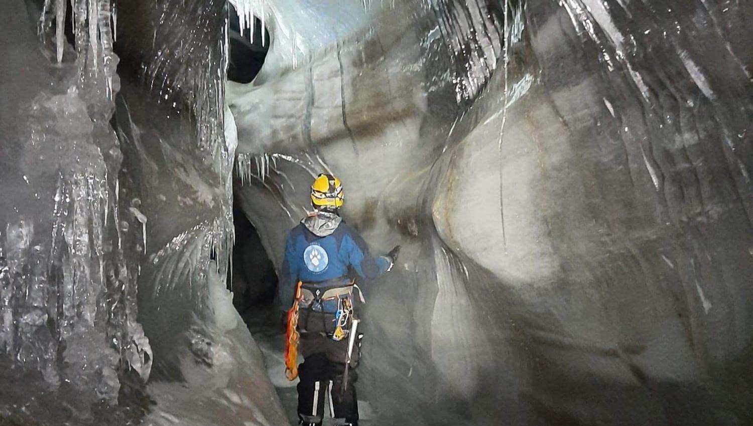 A person inside an ice cave