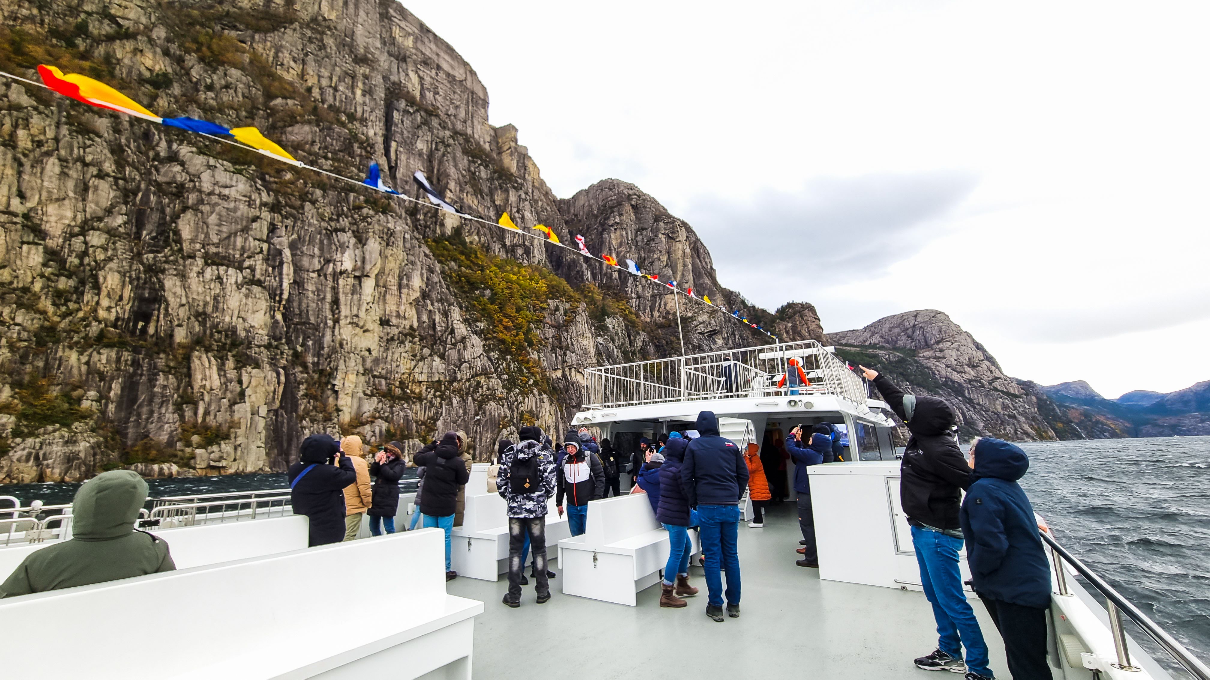 Massive rock walls towering over the fjord