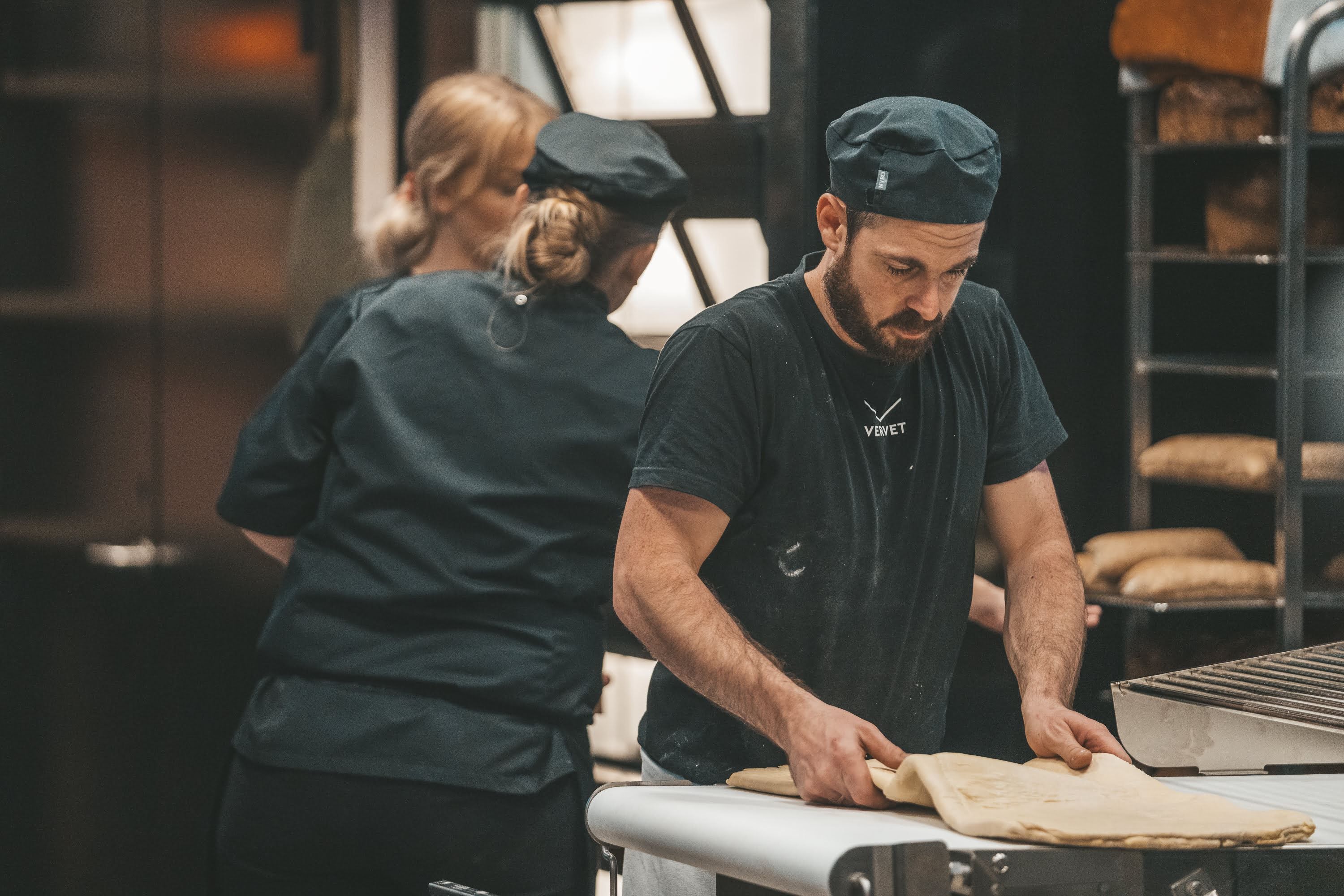Baker working with baked goods