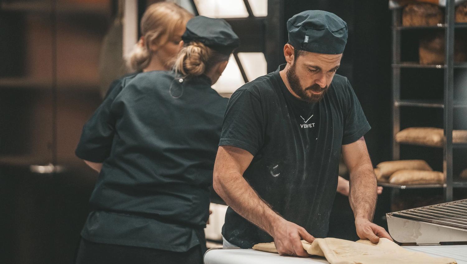 Baker working with baked goods