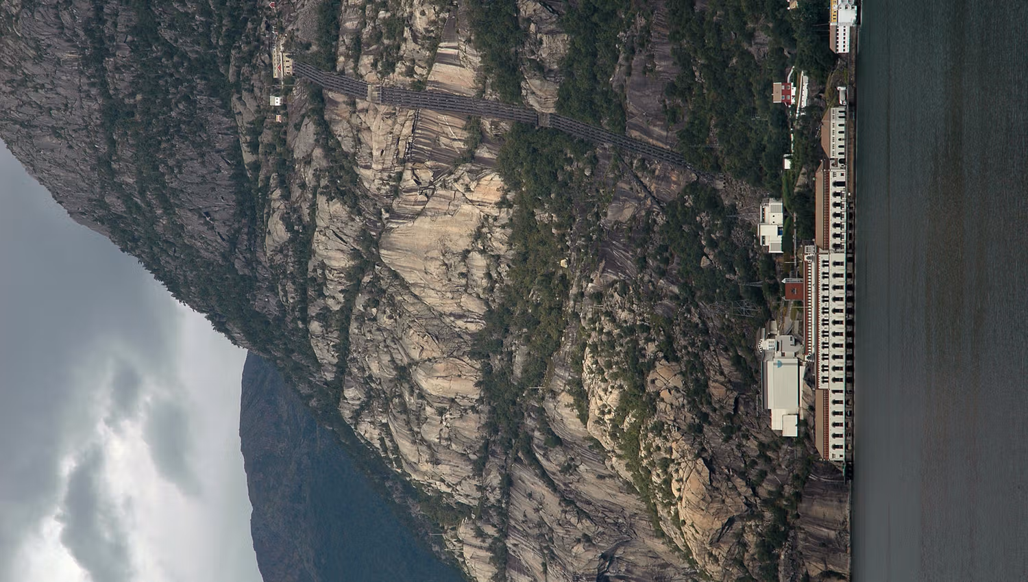 Lilletopp and the power plant seen from the fjord, a historic symbol of Norwegian engineering.