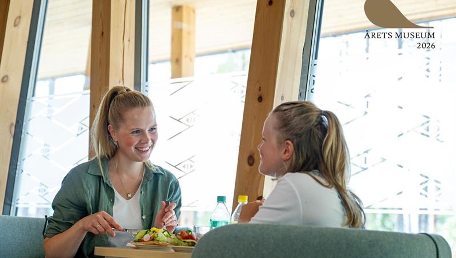2 women enjoying Sami food in the museum cafe