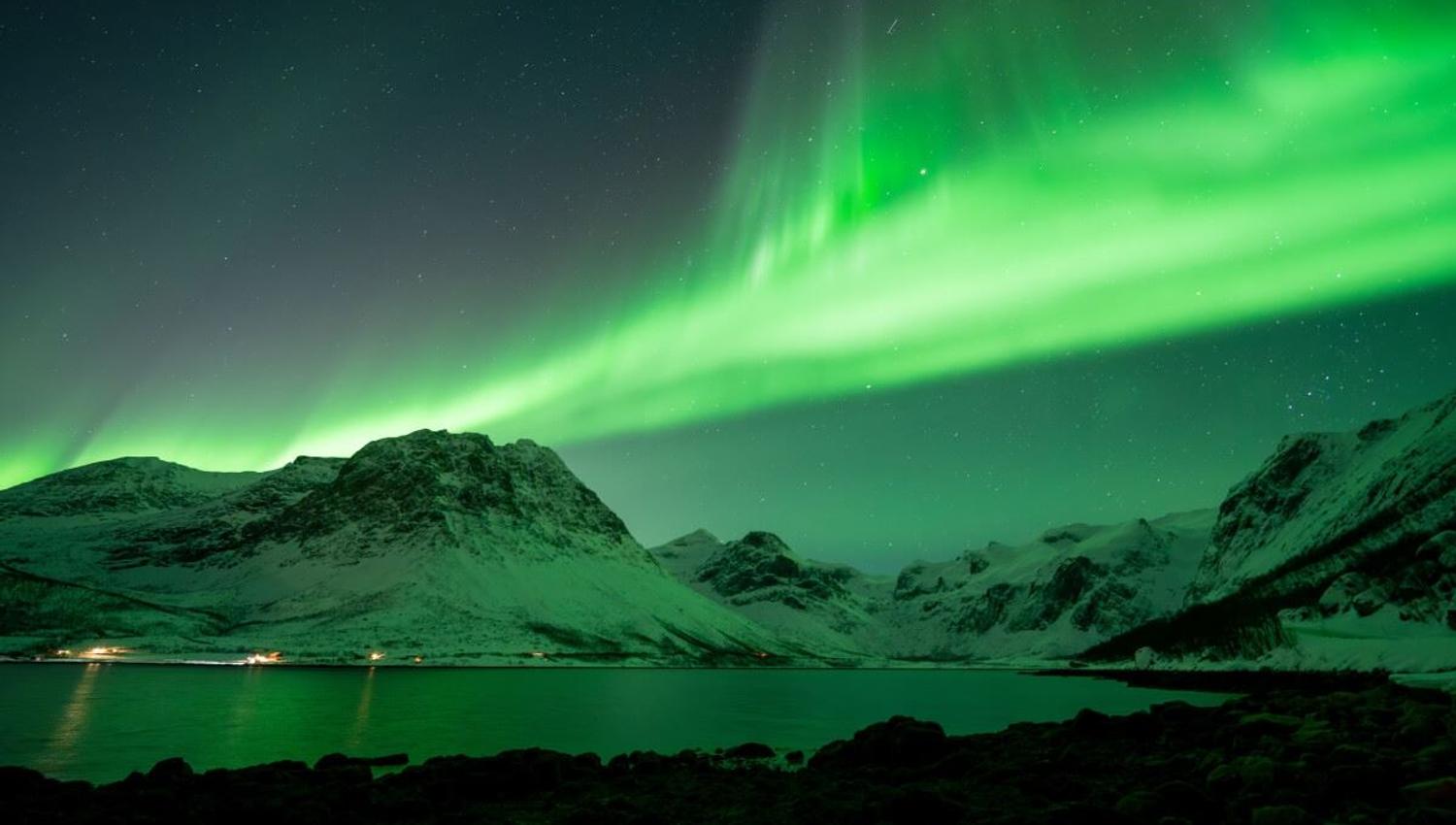 Aurora forms a mass above the mountains