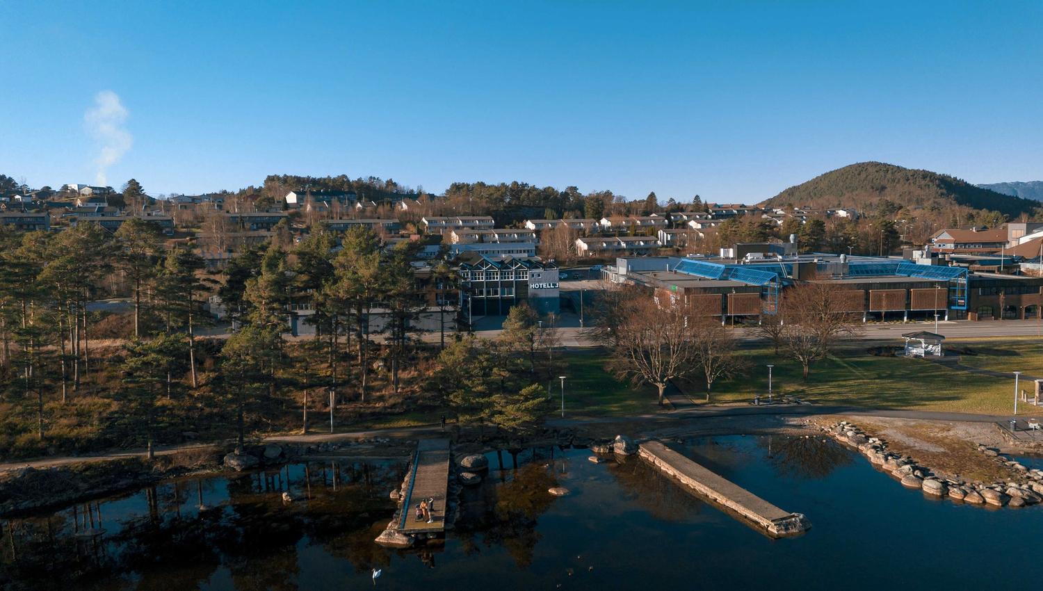 Husnes Sentrum Hotel by the sea, close to scenic walking areas along the Hardangerfjord.