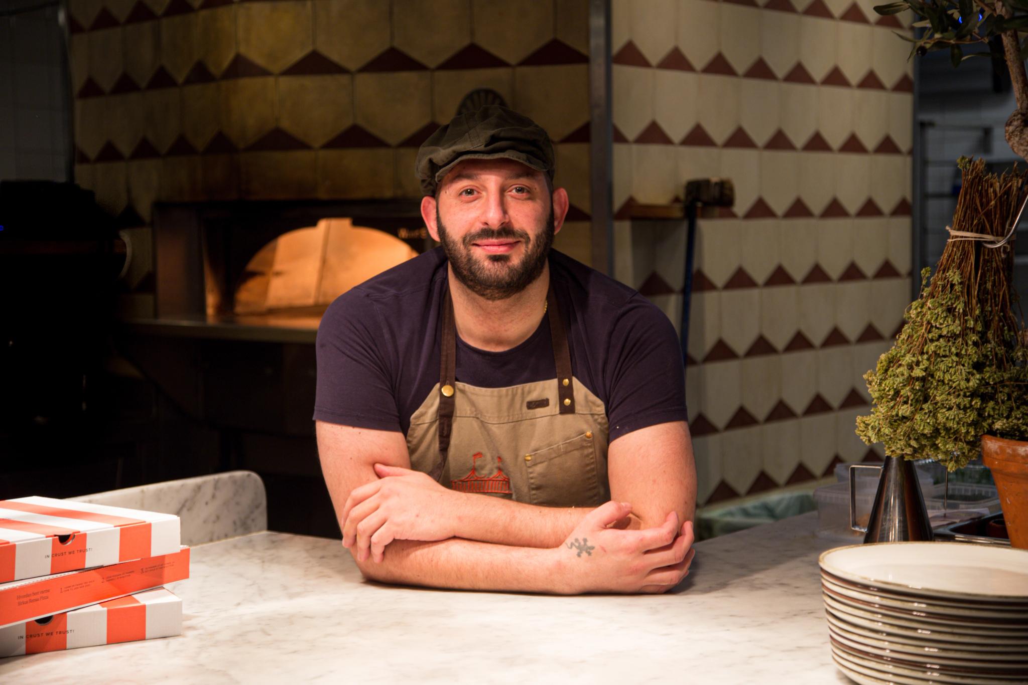 Happy pizza baker