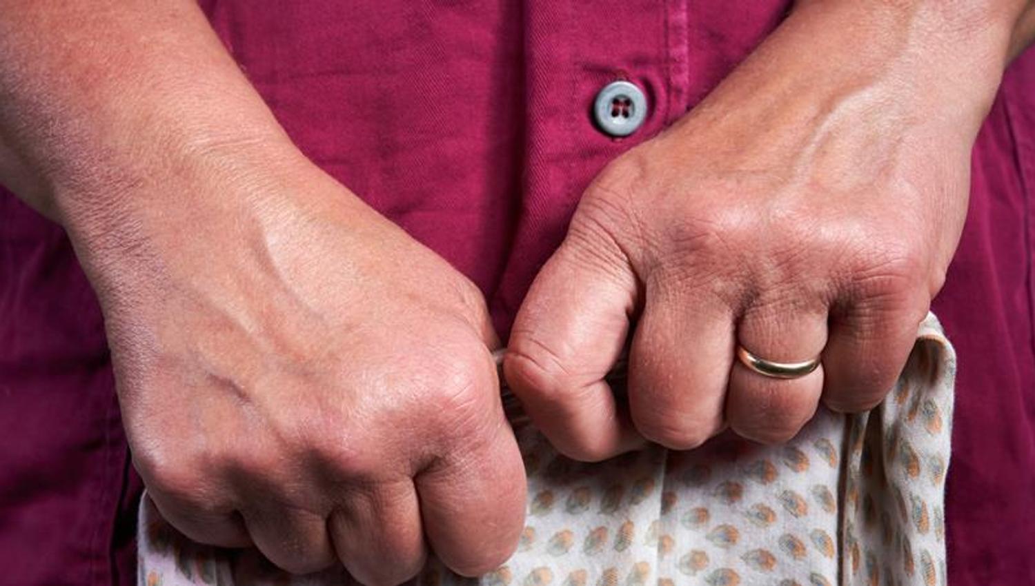 Hands of the cheesemaker.