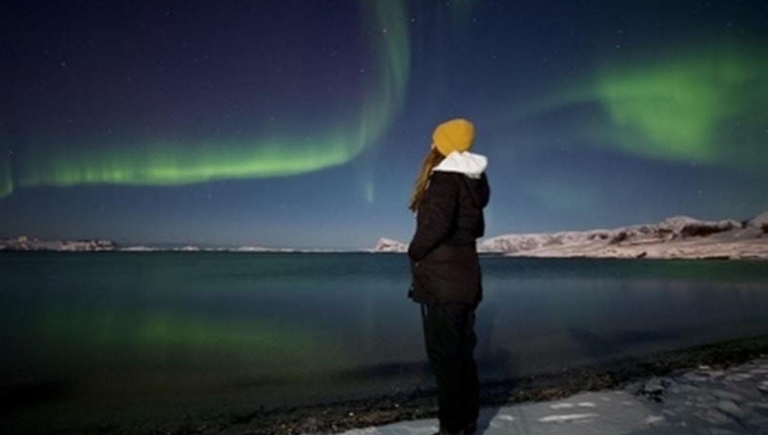 A guest looking at the northern lights