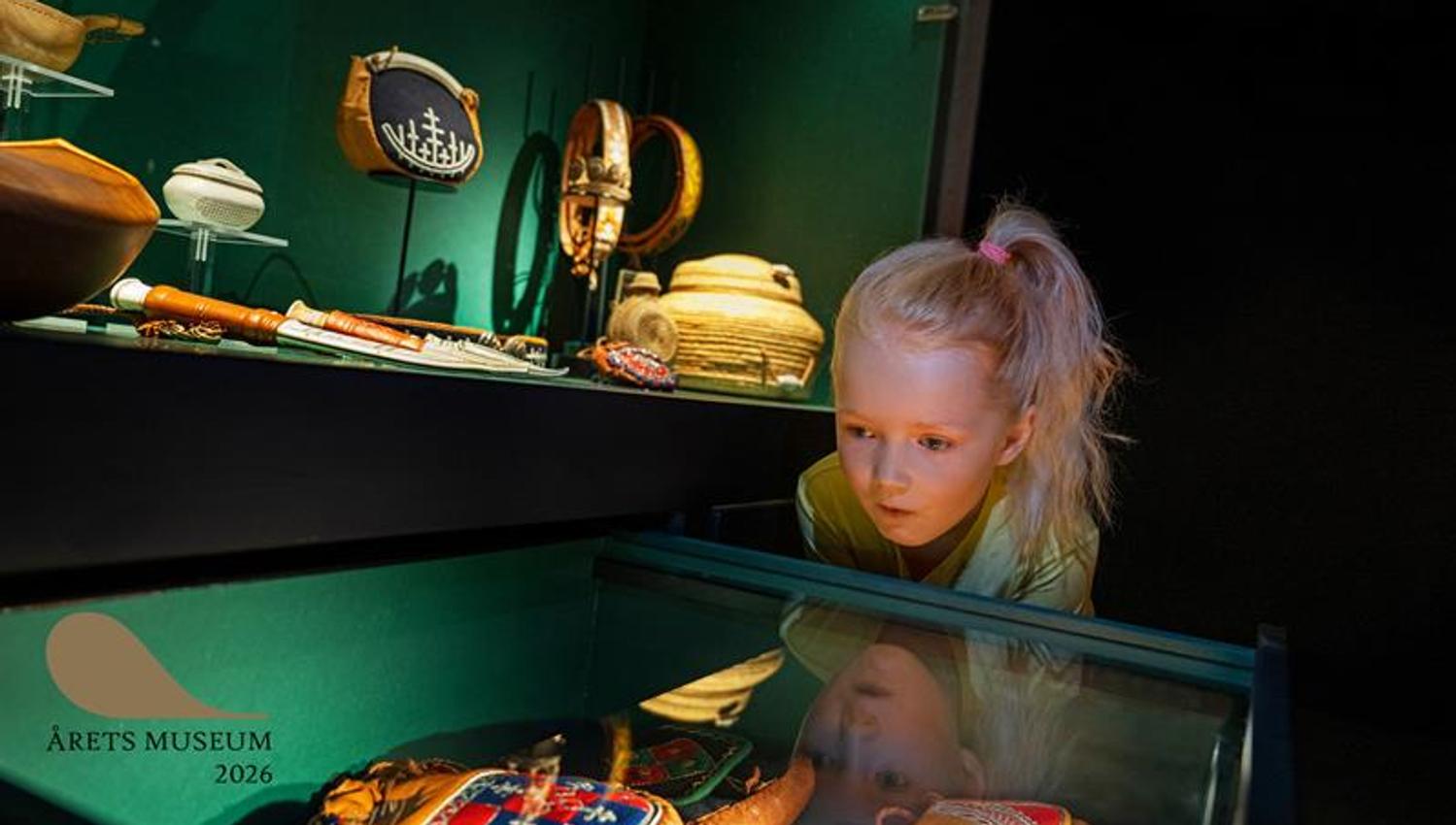 Girl looking at the museum exhibition