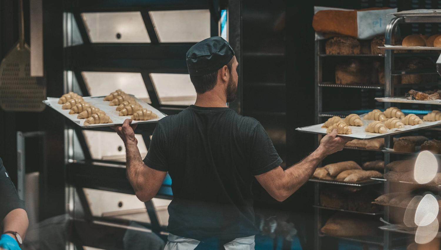 Baker working with baked goods