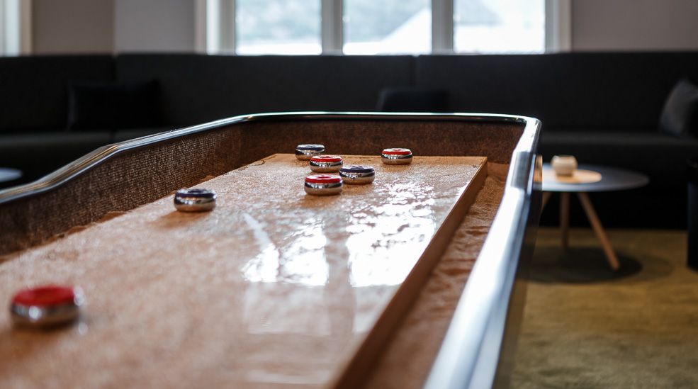 A close up photo of the shuffle board inside the bar.