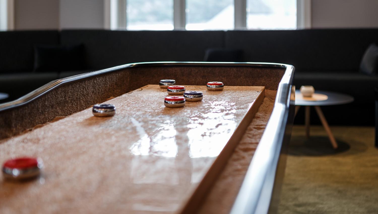 A close up photo of the shuffle board inside the bar.