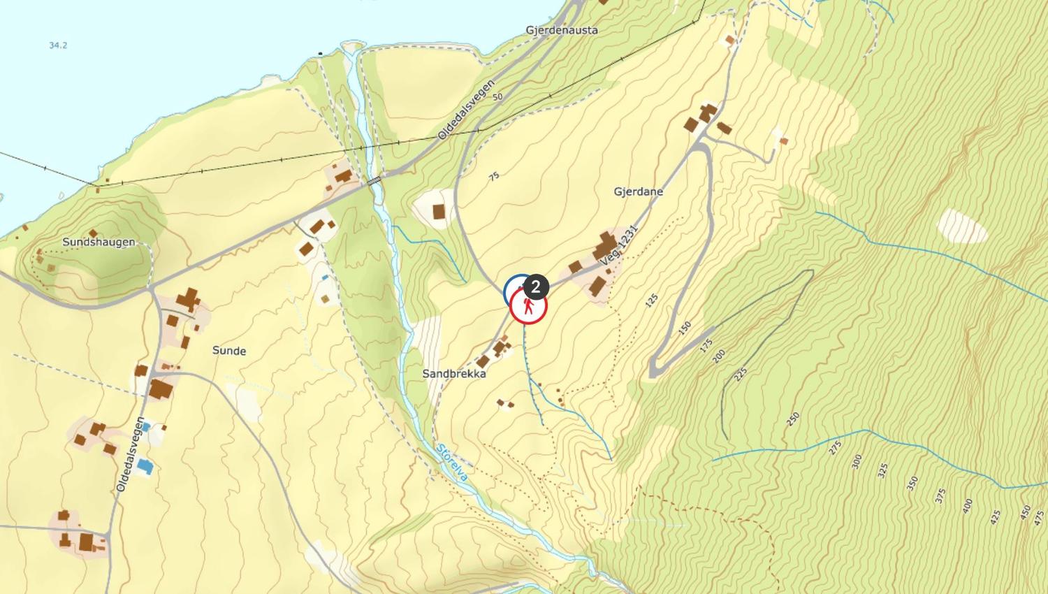 Topographic map with contour lines, roads, streams, buildings, and a red circular marker near Sandbrekka..