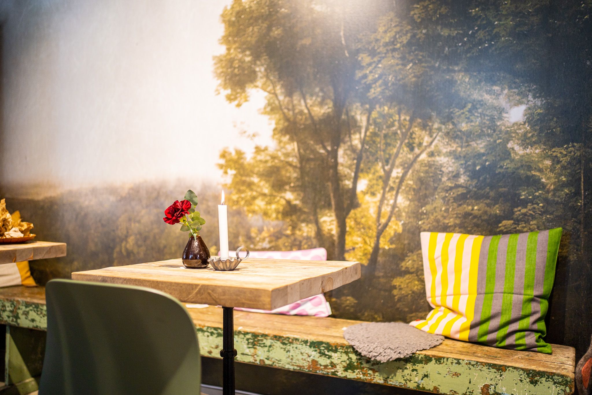 a table and bench at a cafe