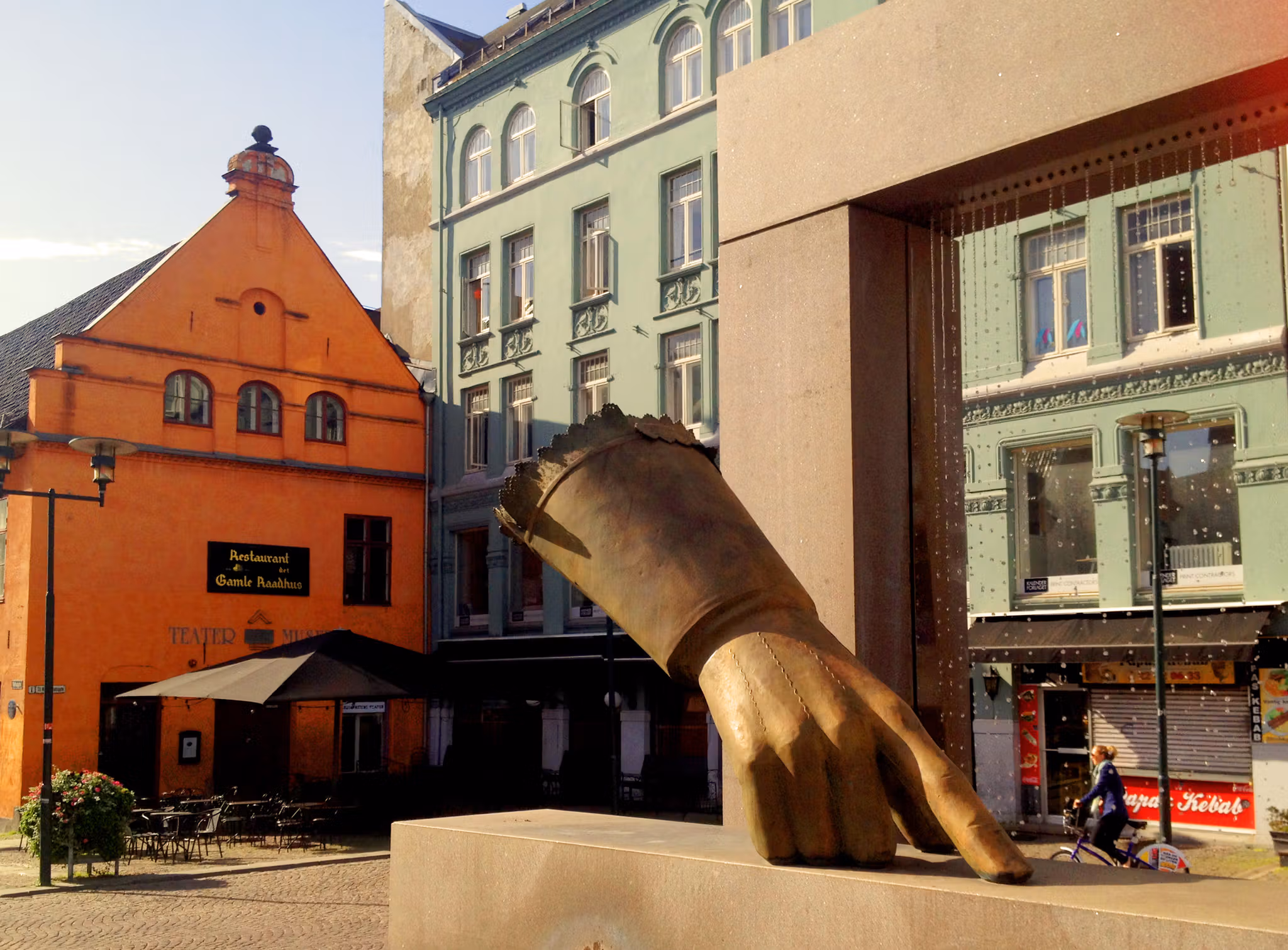 Statue of a hand with an outstretched index finger.