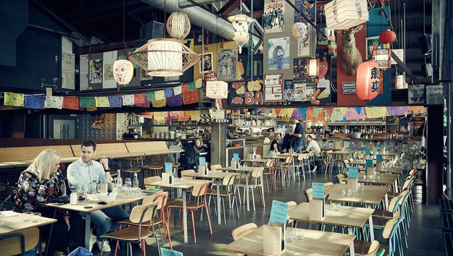 Large dining area with many small tables.
