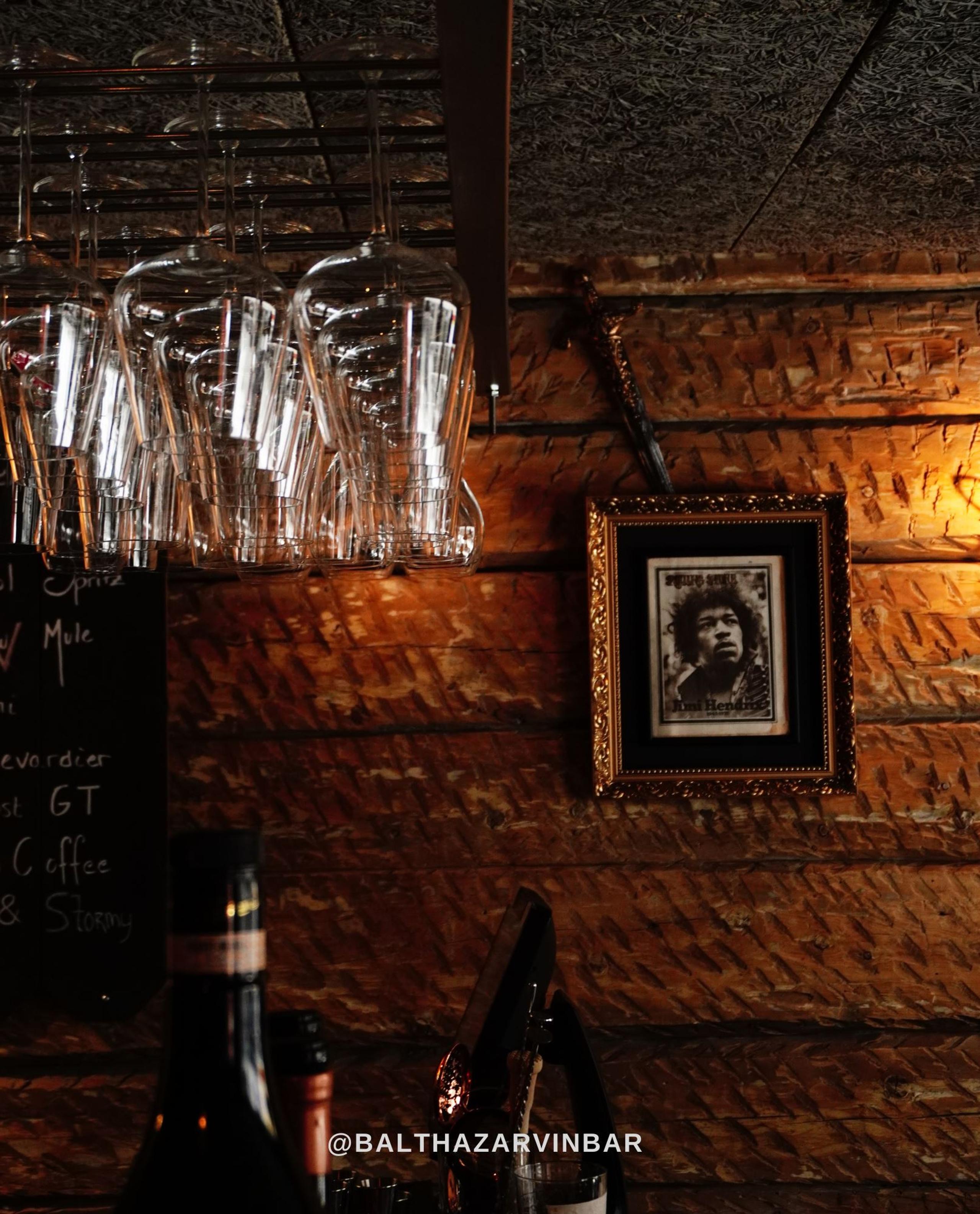 Hanging glasses and a picture on the wall