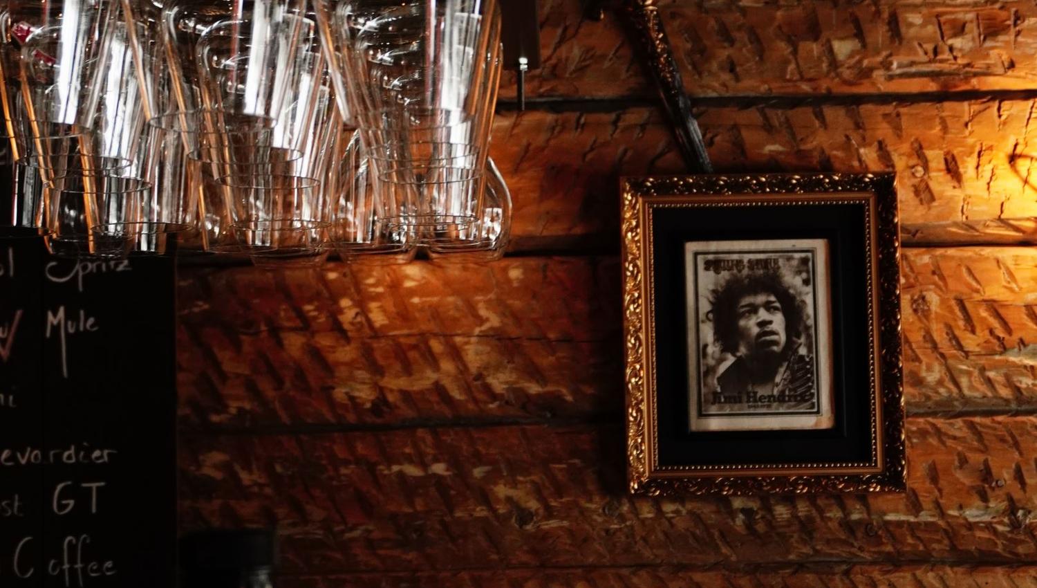 Hanging glasses and a picture on the wall