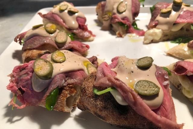 Detail of pizza with Vitello Tonnato topping.
