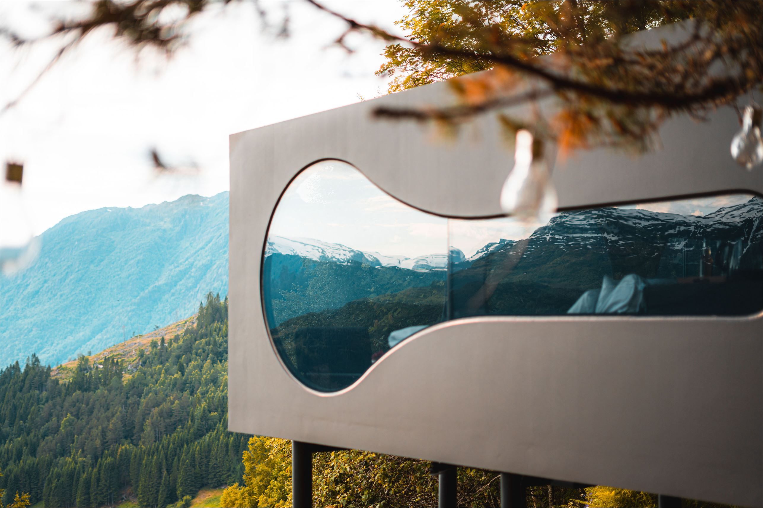 Stunning panoramic view from the Birdbox cabin at Skaara Living on Lotsberg in Nordfjord, surrounded by mountains and fjord landscape.