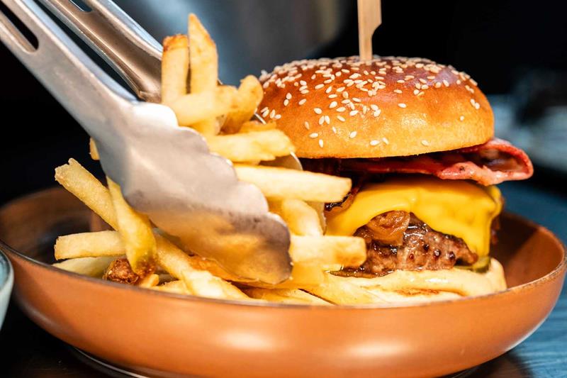 Detail of cheeseburger and fries