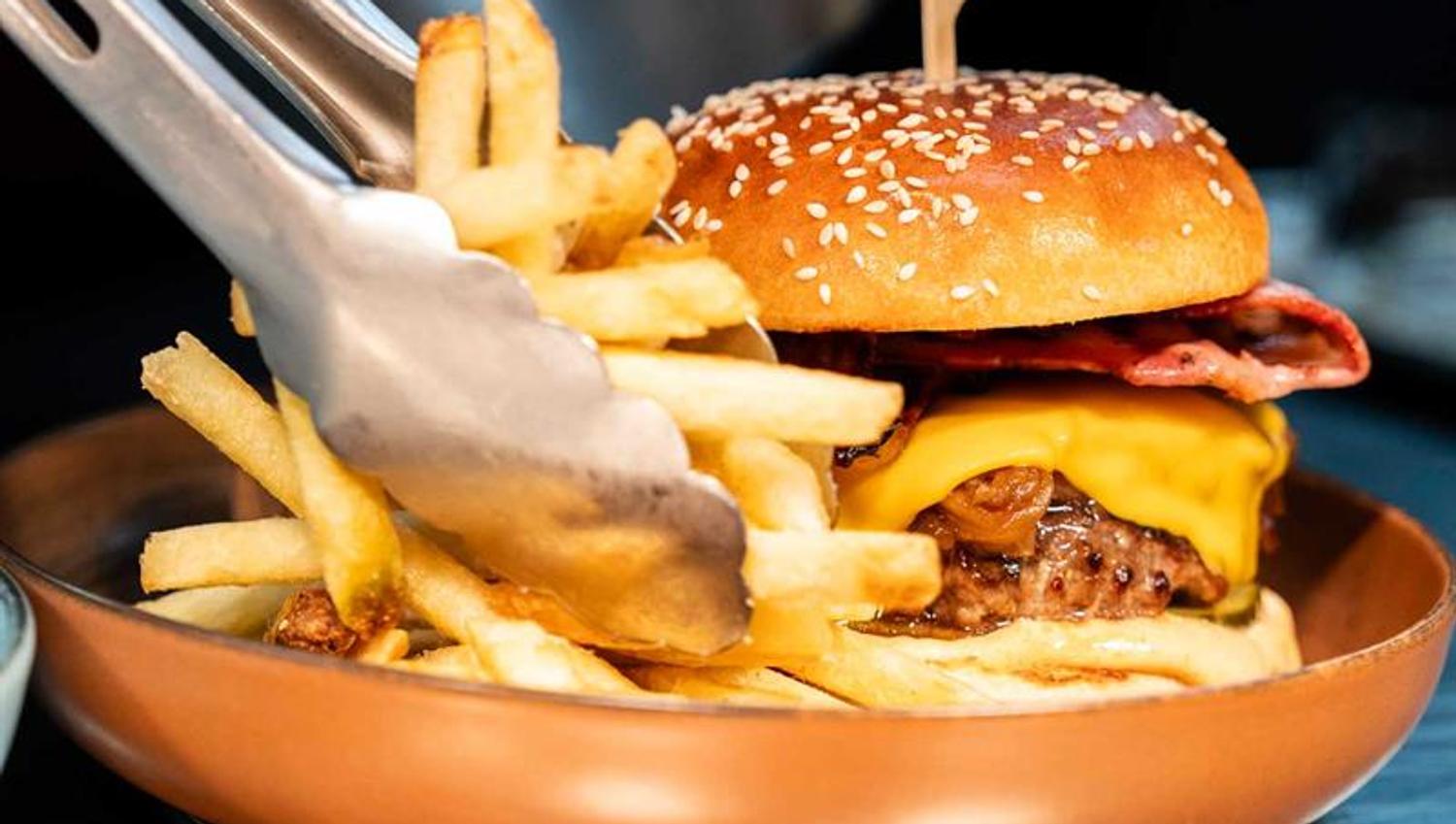 Detail of cheeseburger and fries