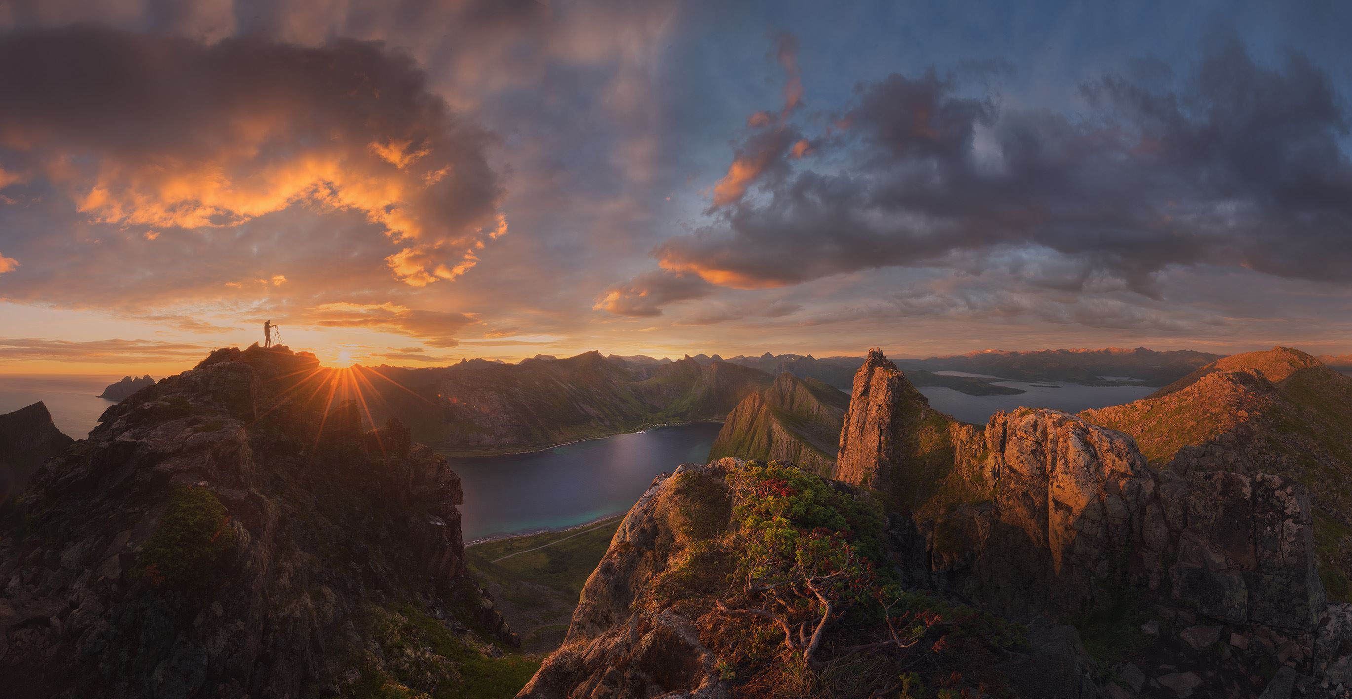 Northern Norwegian evening sun above the mountain peaks on Senja.