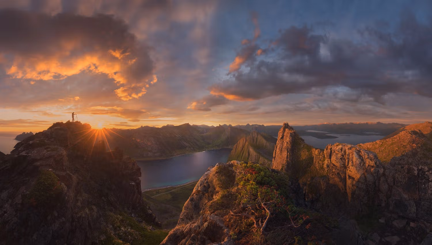 Northern Norwegian evening sun above the mountain peaks on Senja.