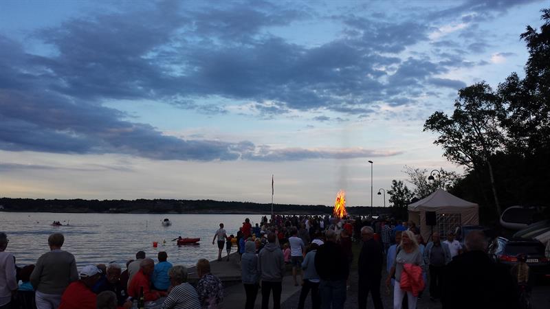 People by the water in an evening
