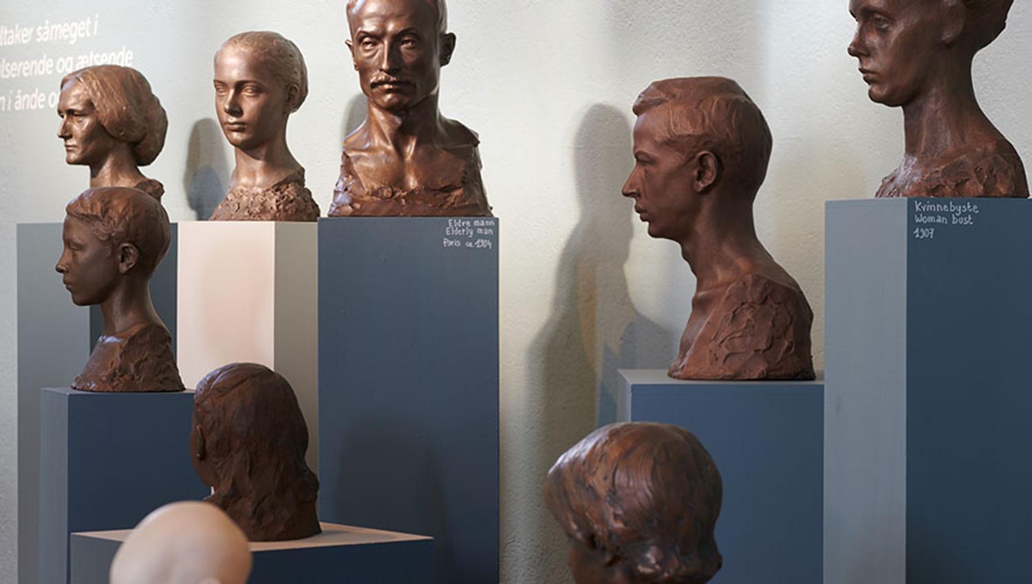 A series of busts exhibited in the Ingebrigt Vik Museum, showcasing portrait art.