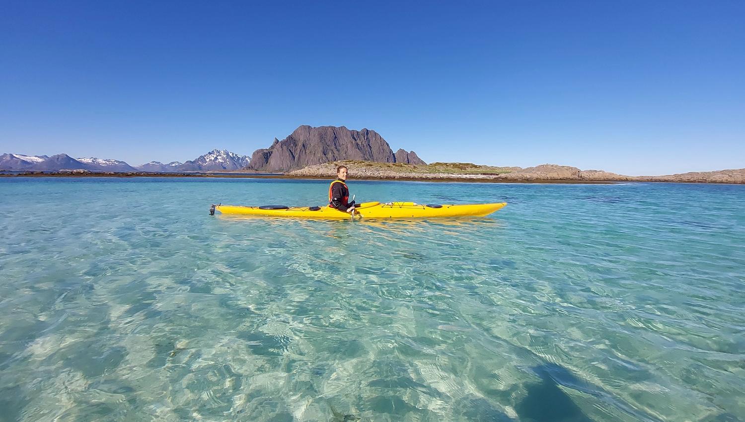 Kayaking on crystal clear water in Skrova