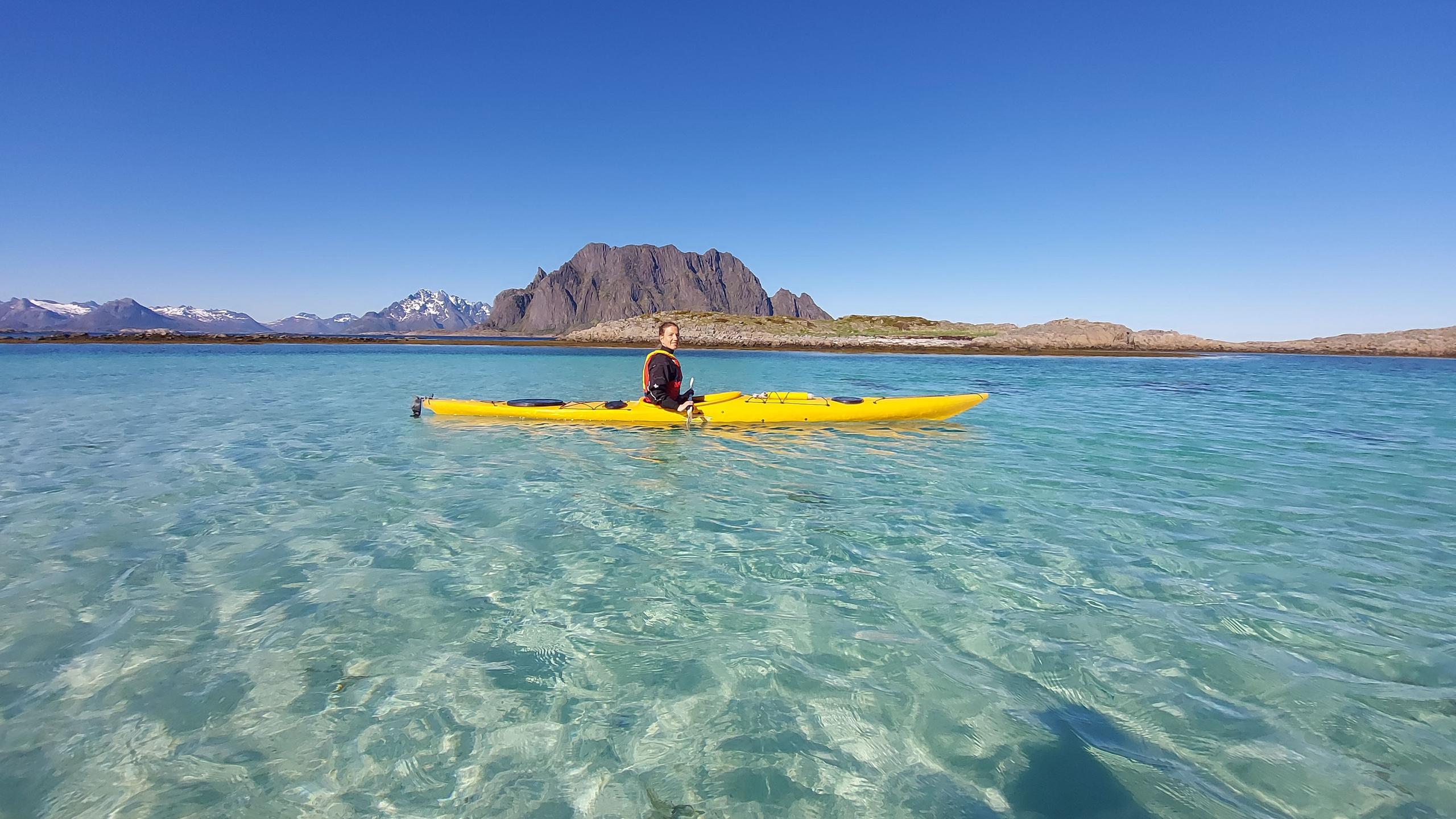 Kayaking on crystal clear water in Skrova