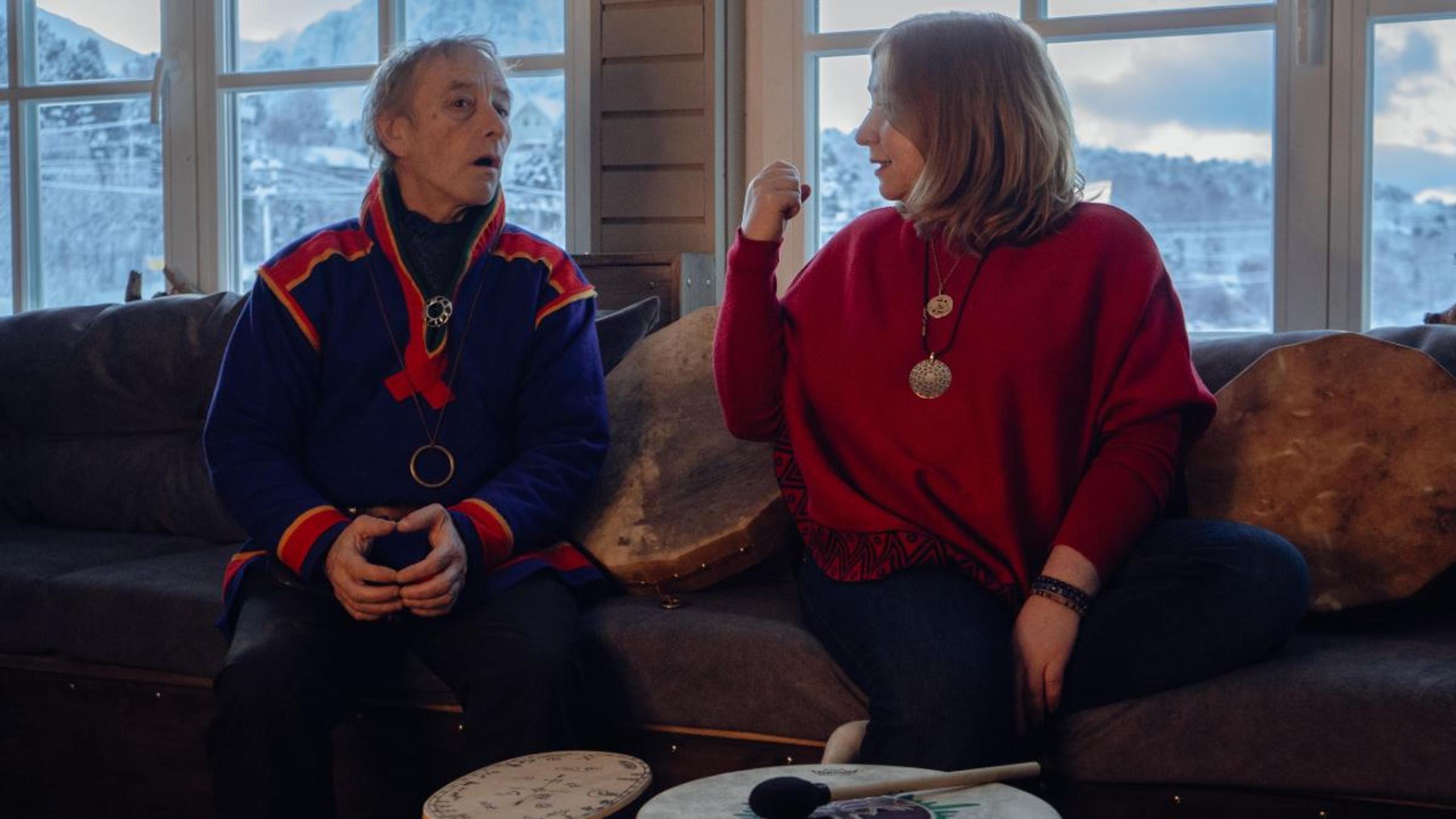 A guest listens to stories and learns more about Sámi culture during an experience at Troll Havn.