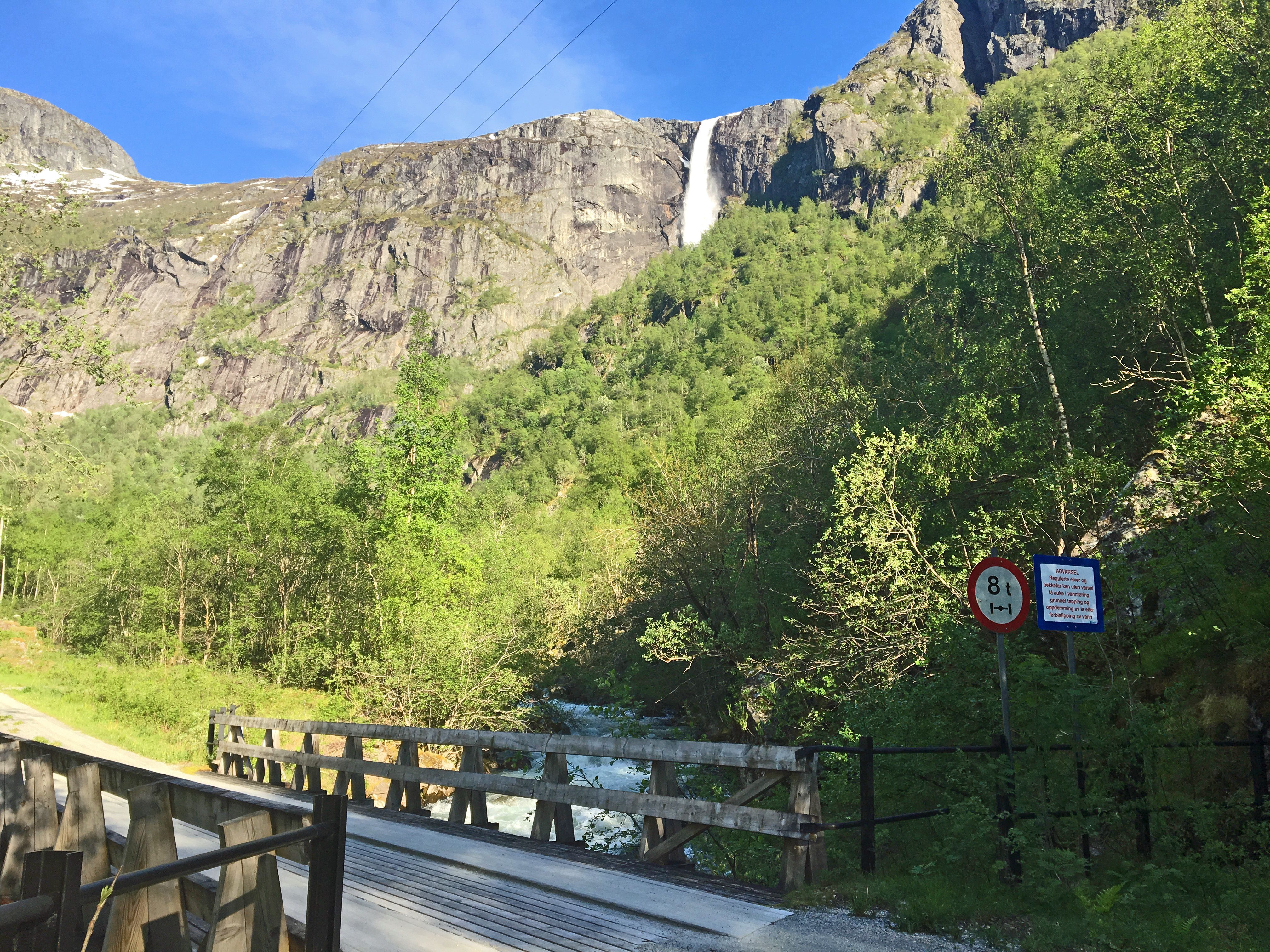 A small bridge on the road below the waterfall.