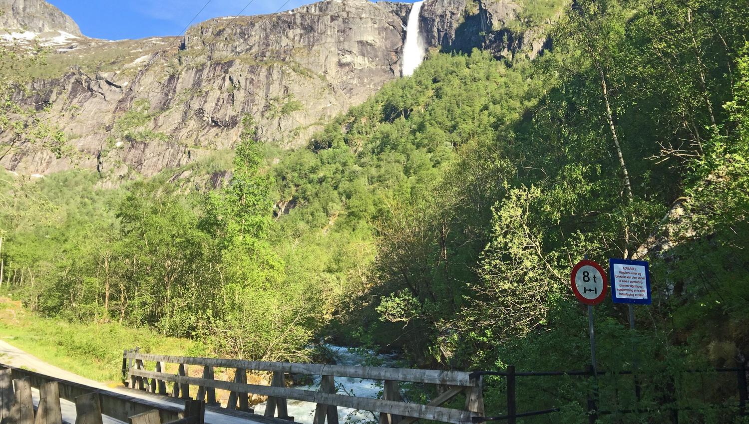 A small bridge on the road below the waterfall.