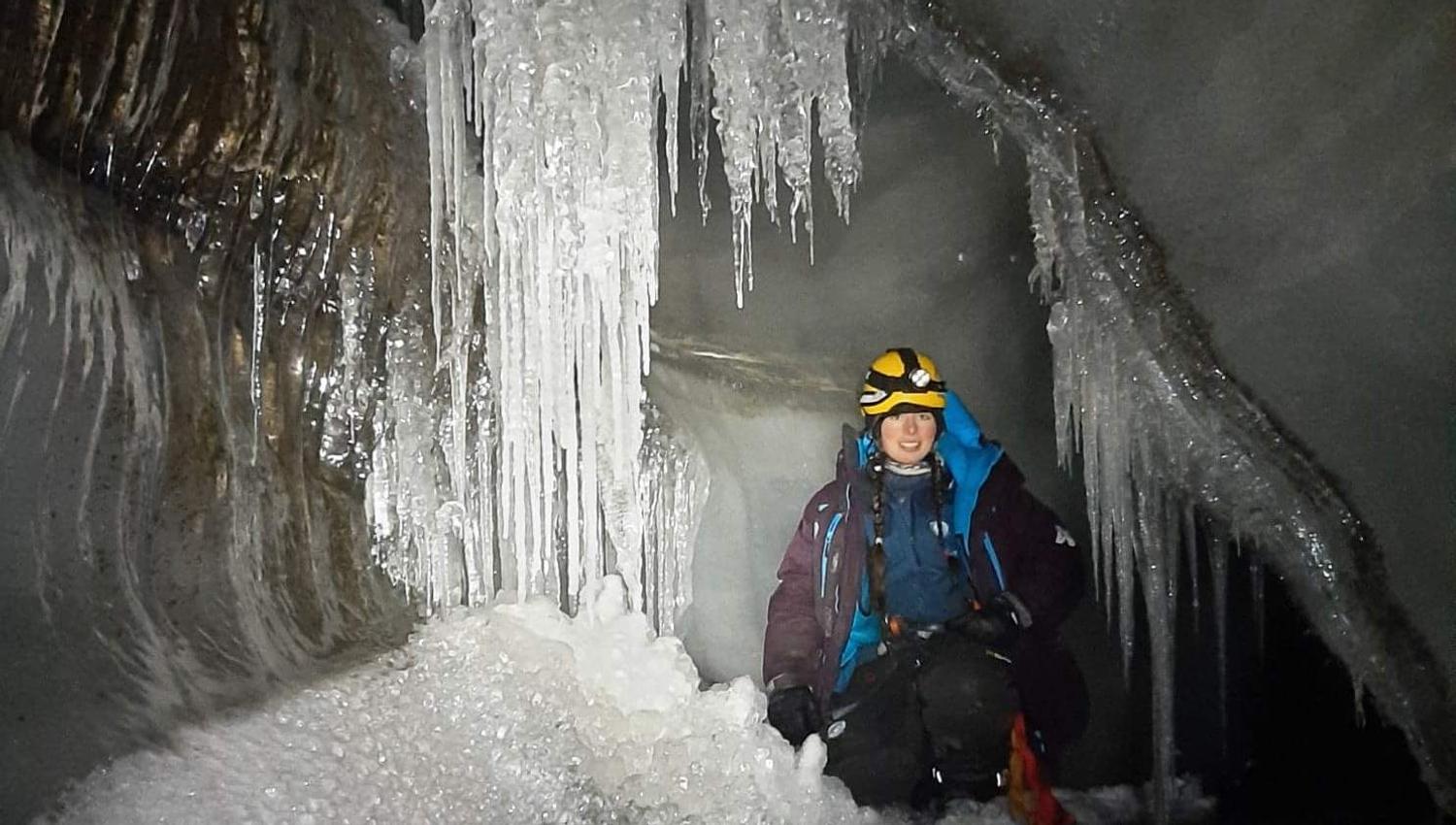 A guide inside an ice cave