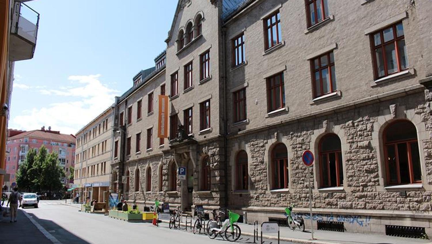 Exterior view of the Intercultural Museum in a historic building along a city street with bicycles and pedestrians outside.