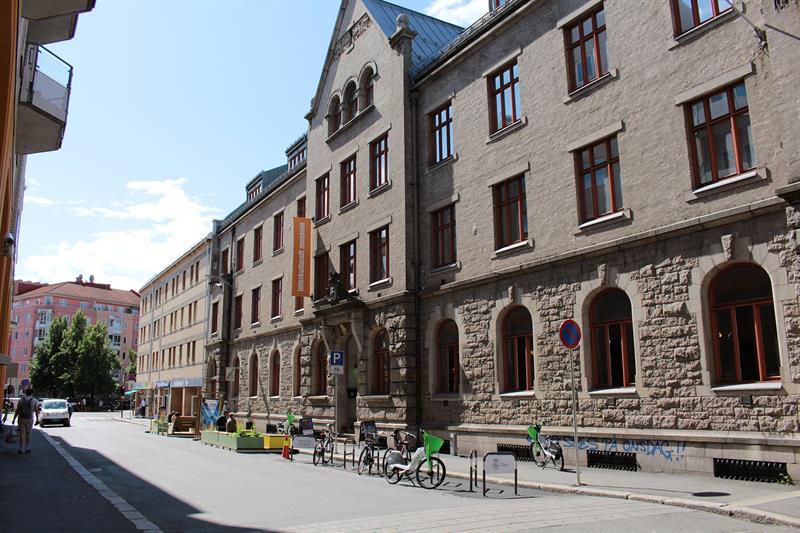 Exterior view of the Intercultural Museum in a historic building along a city street with bicycles and pedestrians outside.