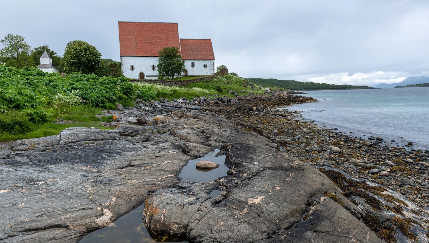 Arcticoncepts-Harstad-Trondenes medieval church-fjord-water-foto Dag Roland