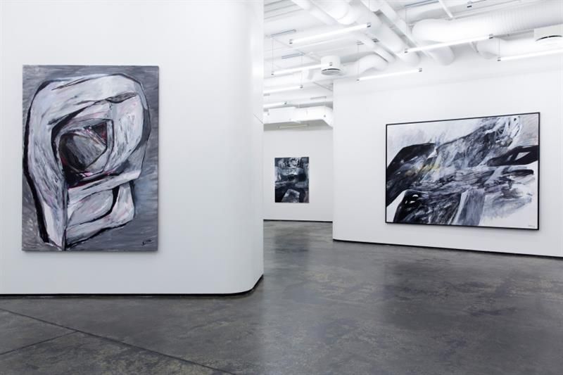 Gallery Brandstrup interior: Large abstract paintings along the walls.