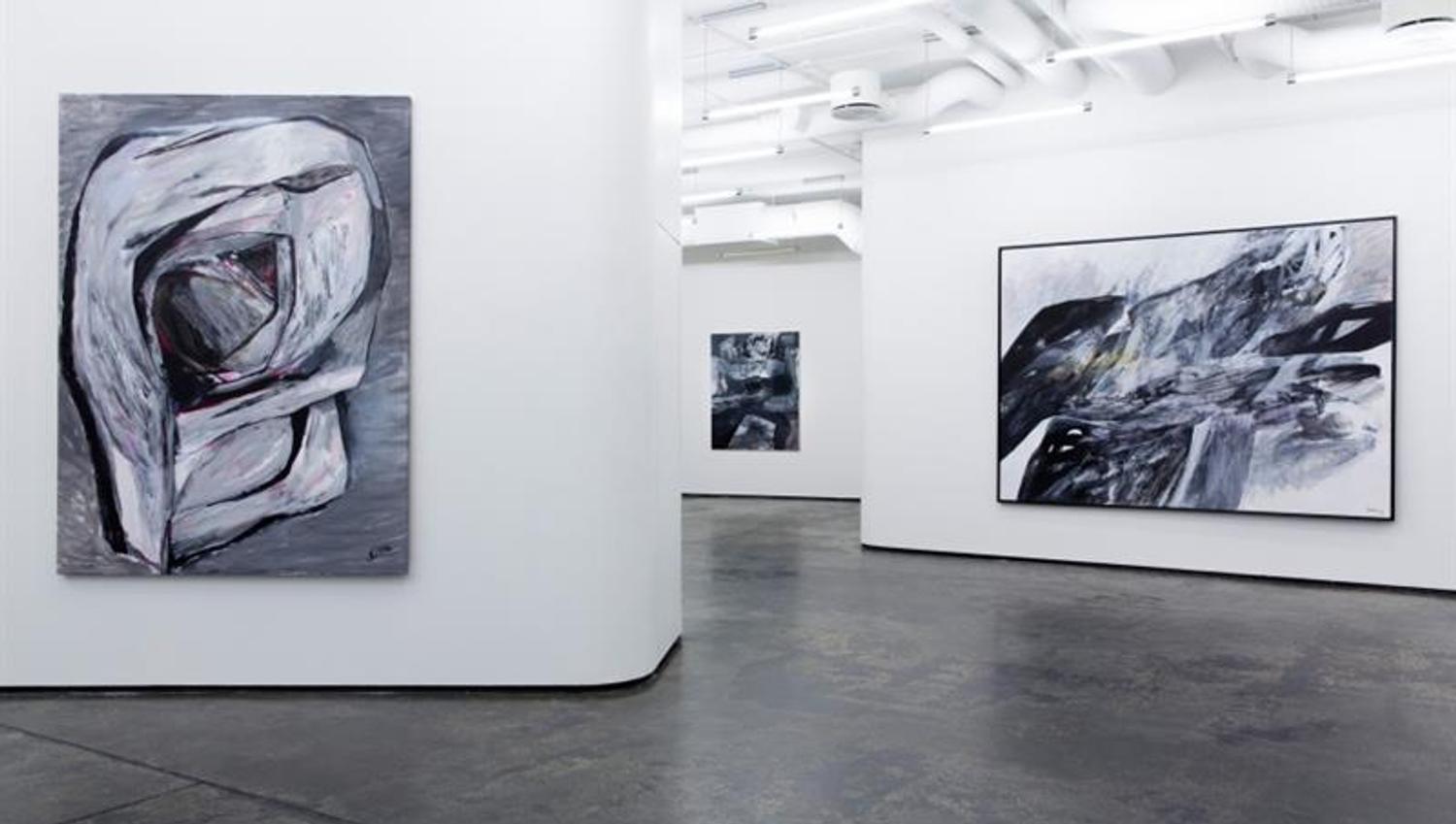 Gallery Brandstrup interior: Large abstract paintings along the walls.