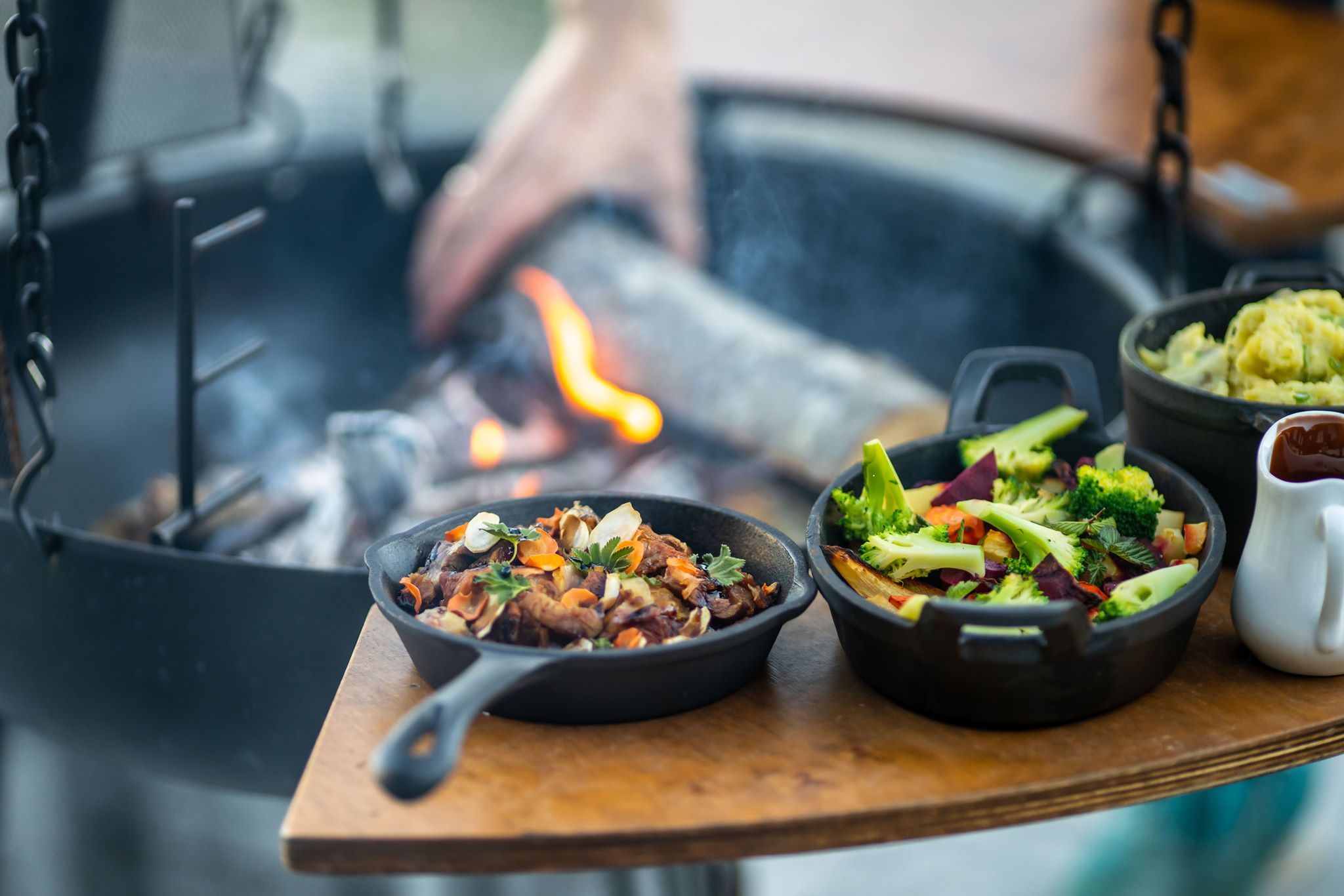 Delicious grilled dishes cooked over an open fire, served with fresh, local ingredients.