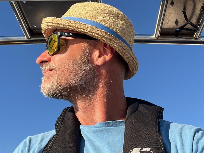 Captain Halfdan with sun hat and life jacket