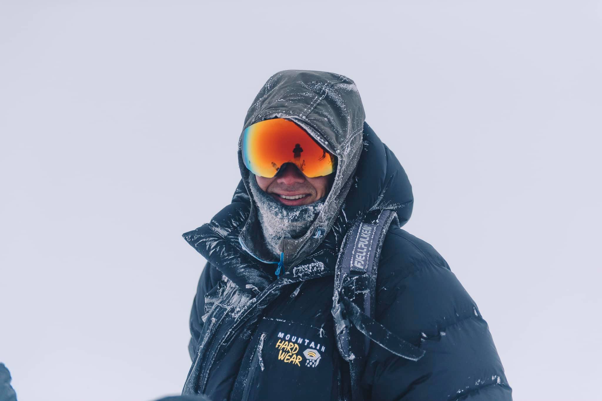 A person with skiing goggles and clothes covered with frost