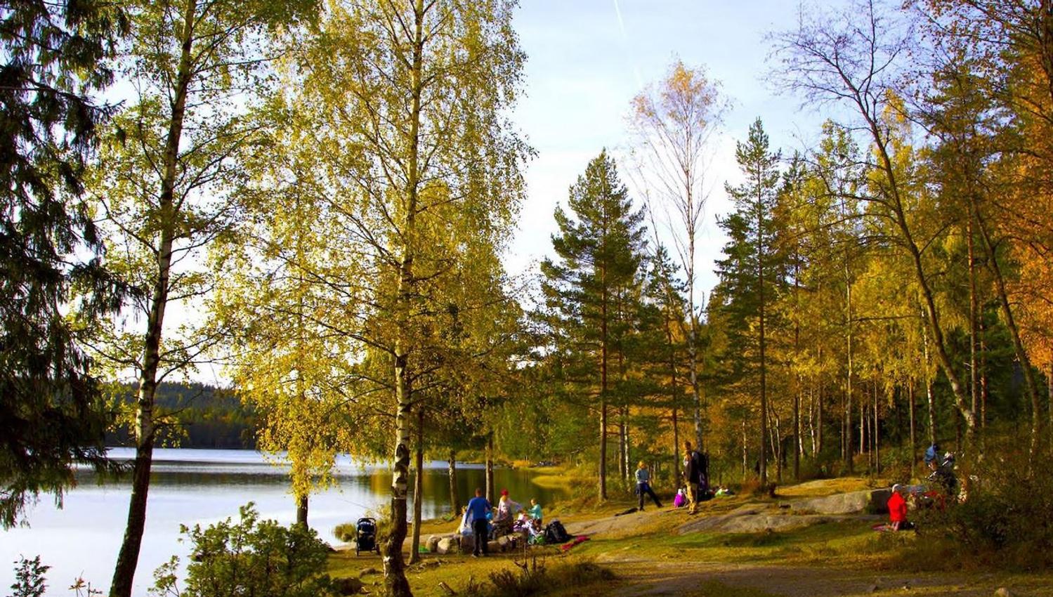 hikers sitting by the water